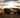 Pickup trucks lined up in a row, representing various brands with unique design features and characteristics, highlighting the diverse options available for truck enthusiasts on the website.