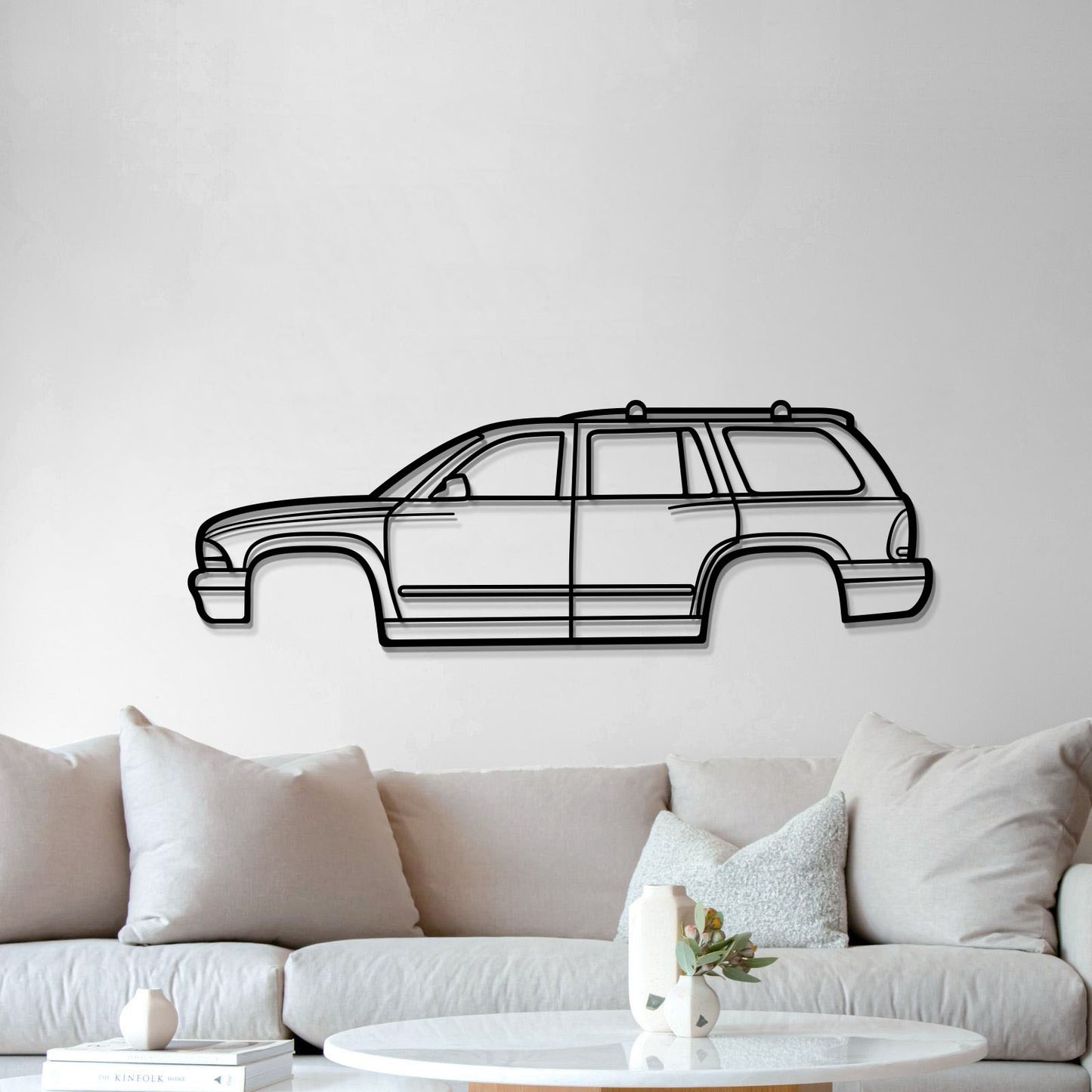 Durable 2002 Durango metal wall plaque in matte-textured steel, lifted 1 cm for a striking automotive display.