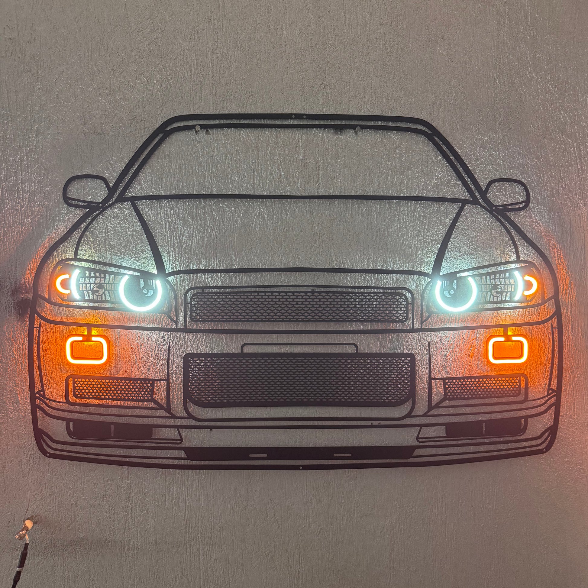 GT‑R R34 front neon car sculpture – sleek décor emphasizing the A80’s distinctive quad headlights and aggressive stance